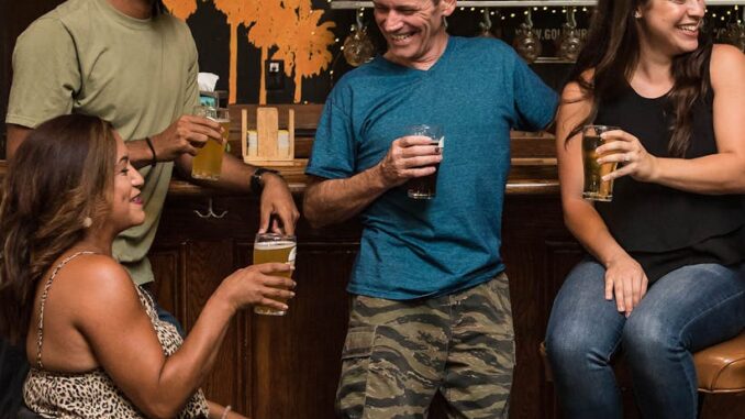 people on the bar drinking and conversing